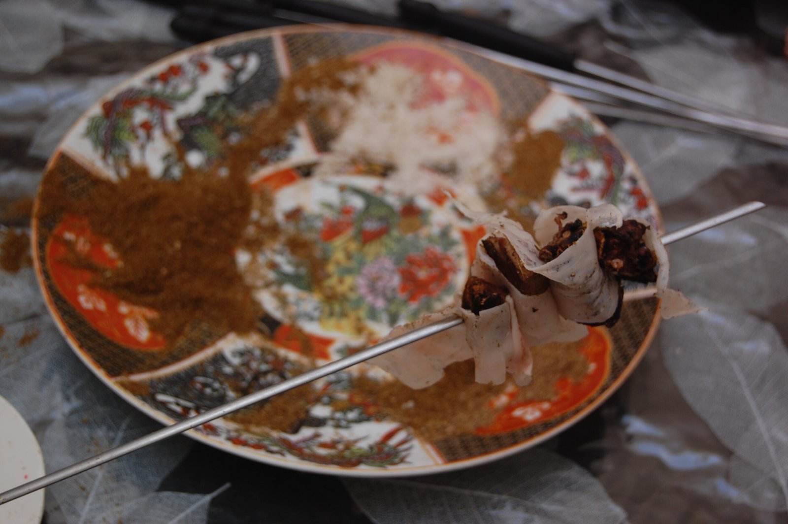 Brochettes grilling over charcoal at a Moroccan street food stall