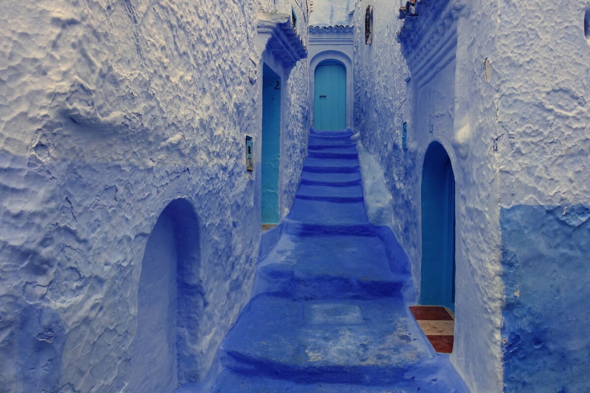 The blue-washed medina of Chefchaouen with the Rif Mountains behind