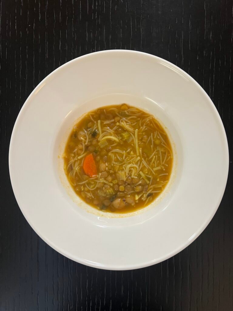 A bowl of Moroccan harira soup with chickpeas, lentils and vermicelli