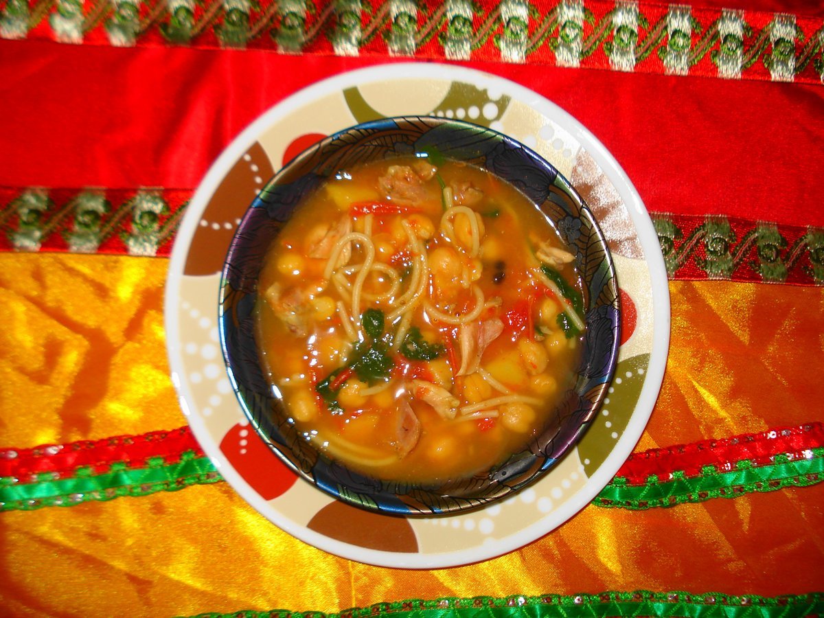 Bowl of harira, traditional Moroccan tomato soup with chickpeas and lentils