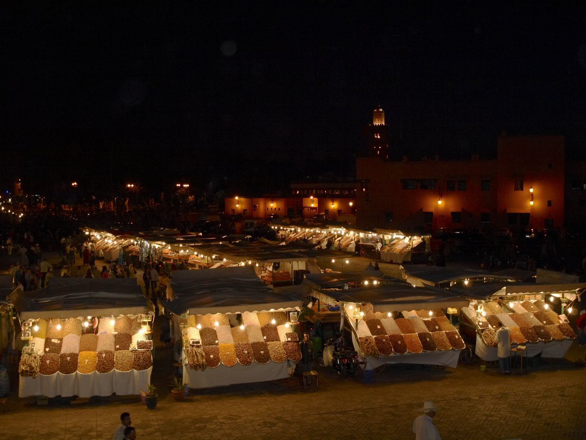 Food stalls lit up at night on Jemaa el-Fna square in Marrakech
