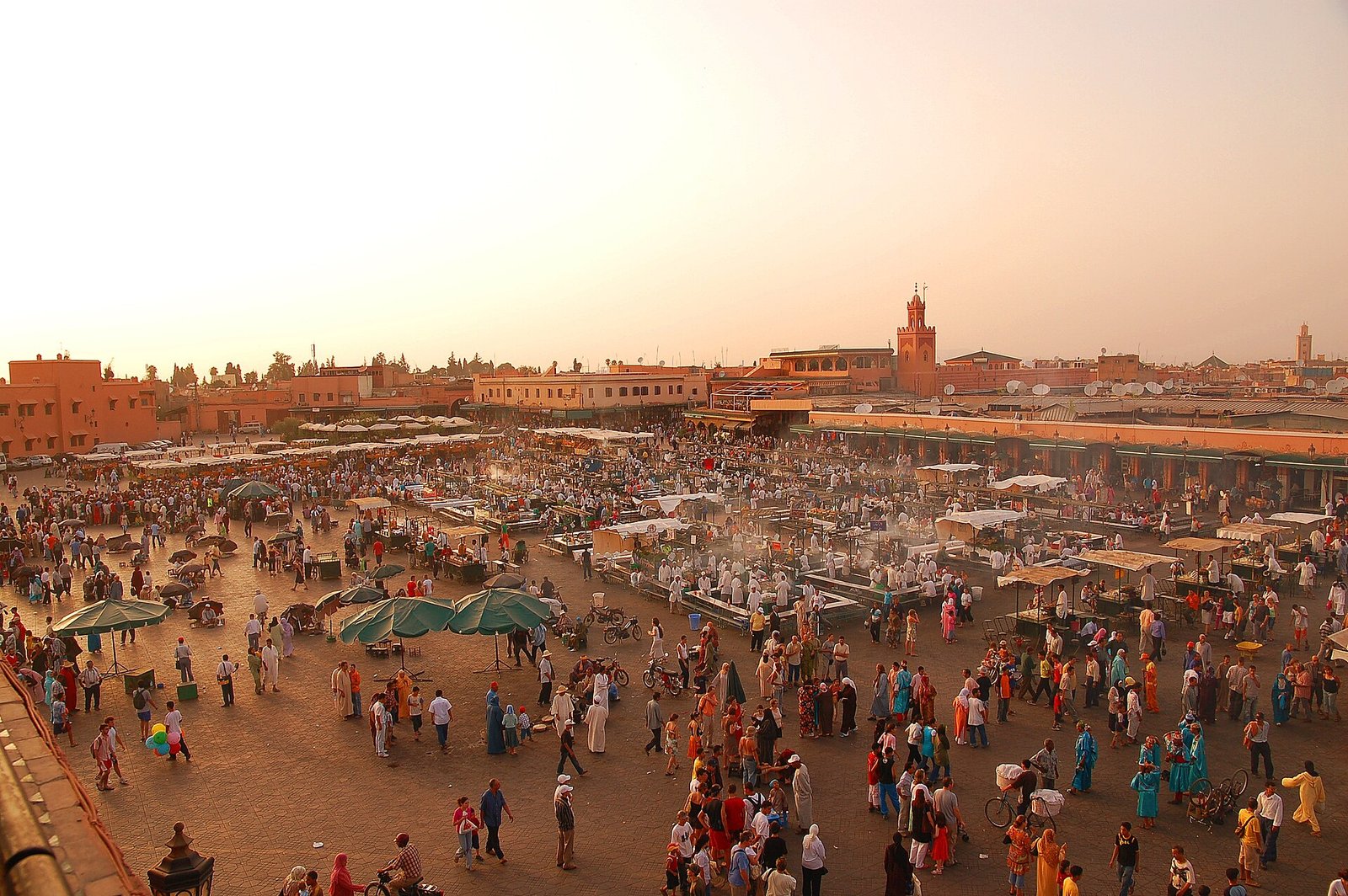 Daytime view of Jemaa el-Fna square in Marrakech with market stalls