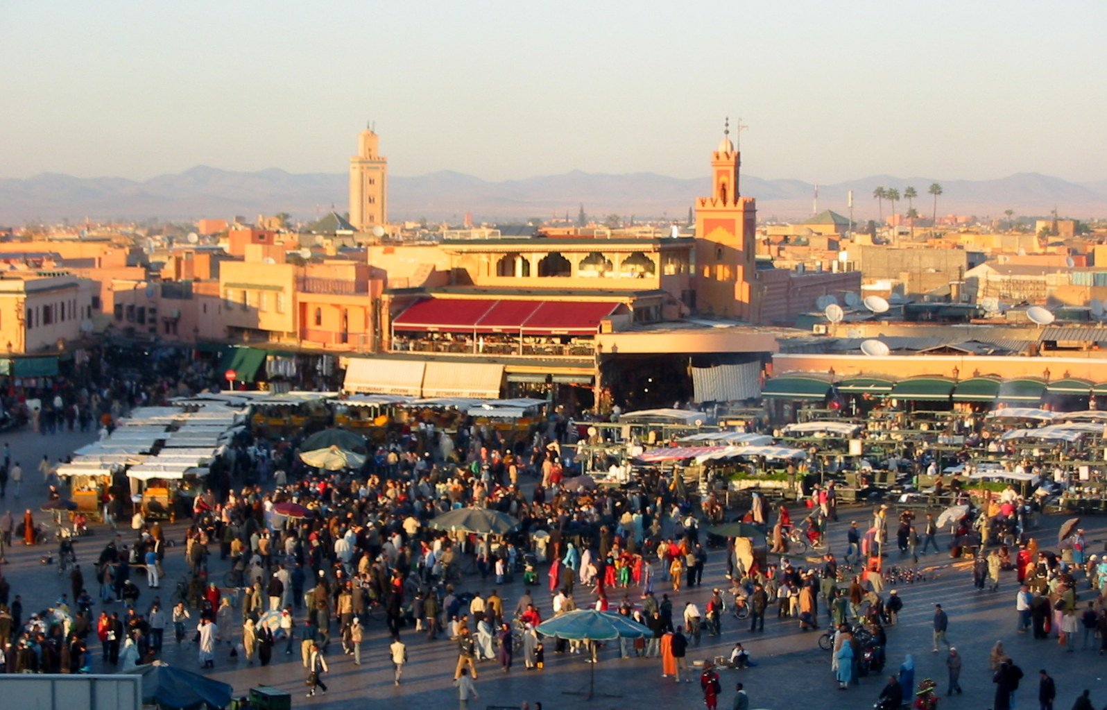 Jemaa el-Fna square at dusk as the food stalls light up for the night
