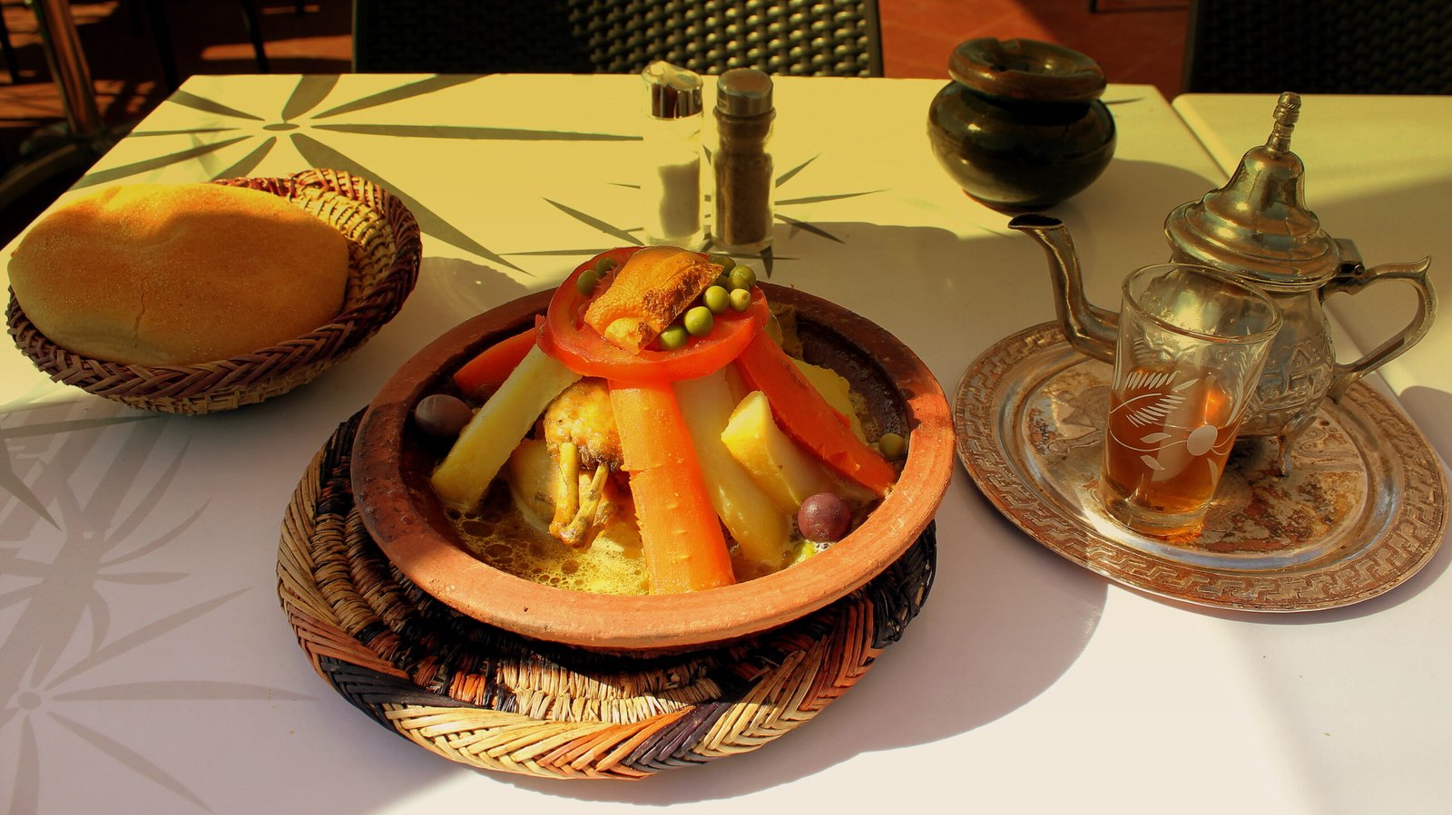 Chicken tagine with vegetables and mint tea served at Jemaa el-Fna, Marrakech