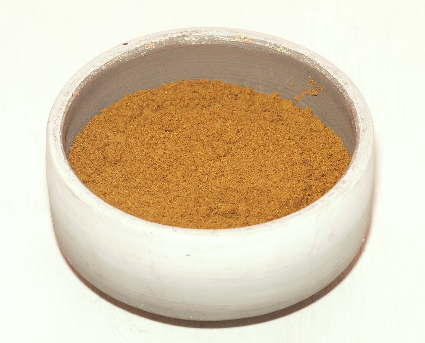 A bowl of ground ras el hanout, the Moroccan spice blend