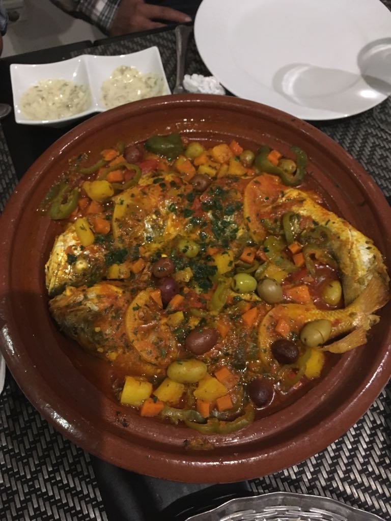 Moroccan fish tagine with sea bream and vegetables in chermoula sauce