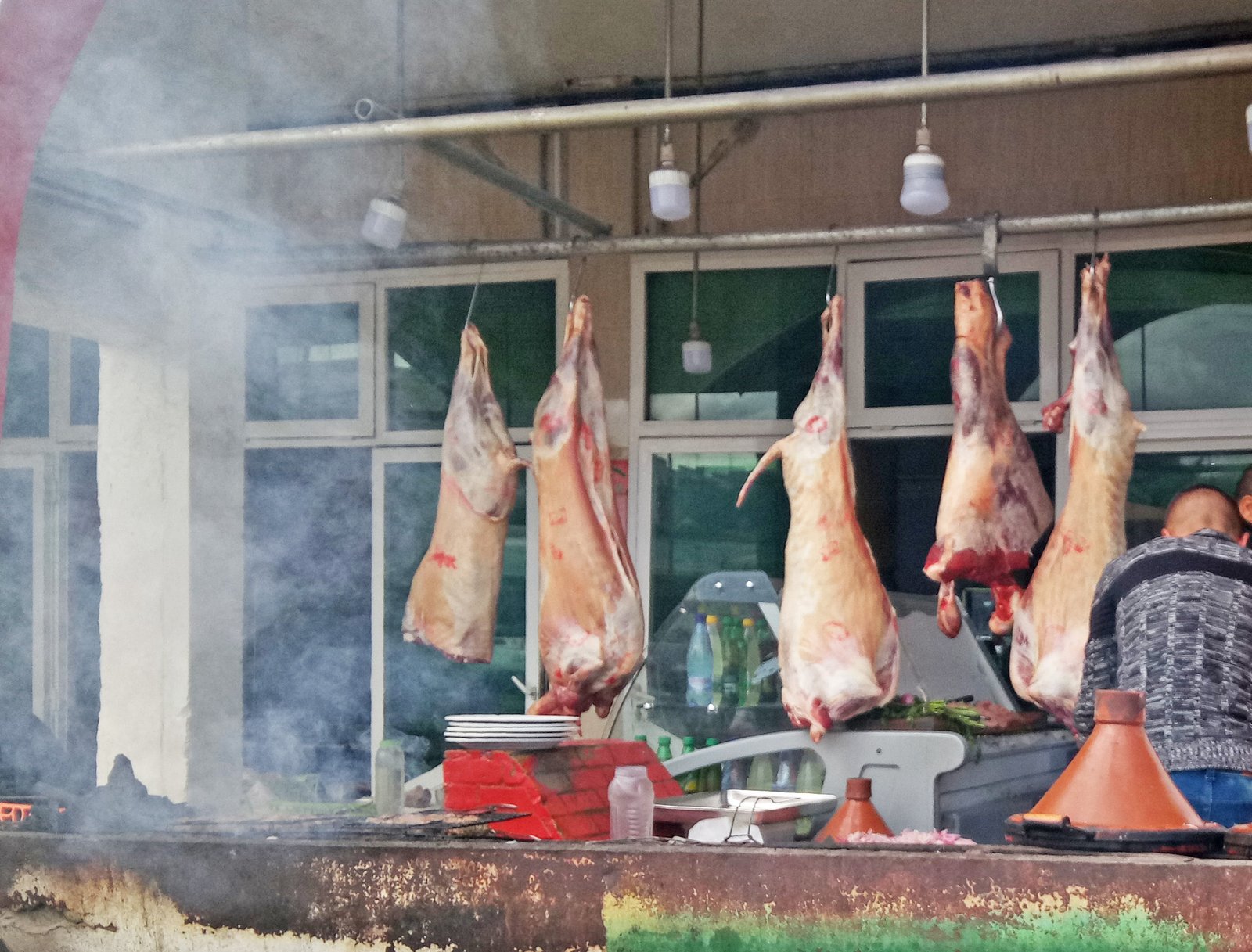 A street food stall in Morocco with tajines cooking